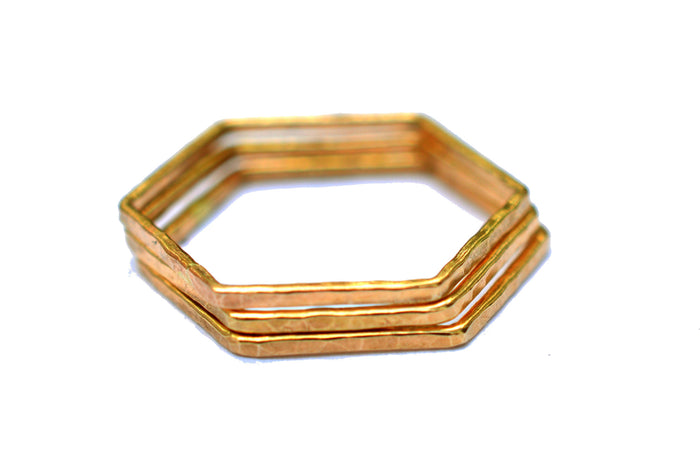 gold hexagon stackable rings by aquarian thoughts jewelry
